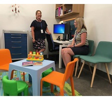 Two health professionals in conversation.