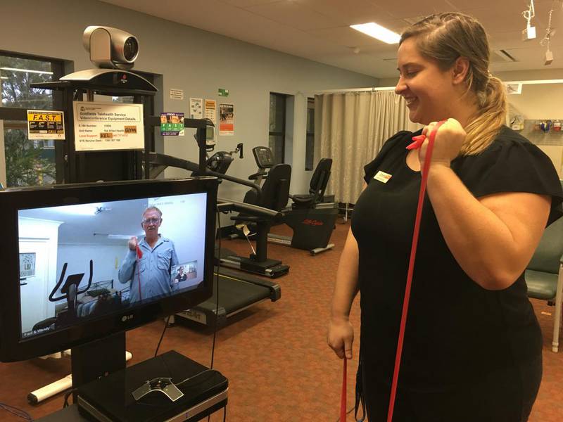 Telehealth user Fred Sellars, who has Parkinson’s disease, goes through some exercises by telehealth with Kalgoorlie Day Therapy Unit Physiotherapist Emma Johansen.