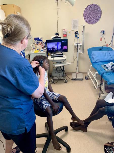 WA Country Health Service Halls Creek Practise Nurse Jenny Vink and five-year-old Letizah McDonald.