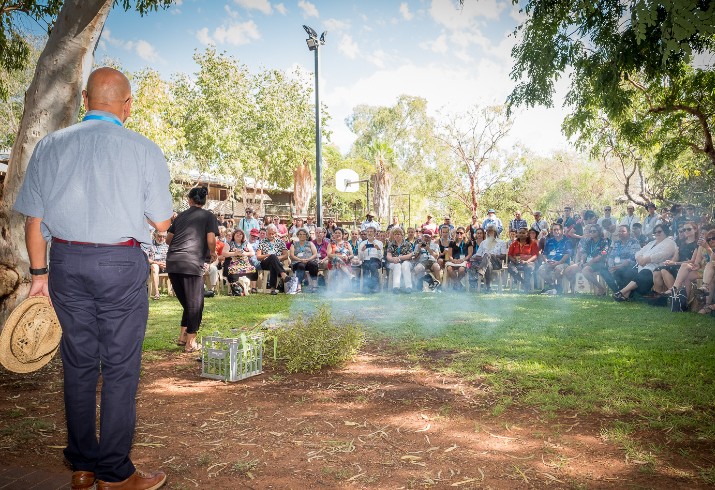 Past conference attendees at smoking ceremony 