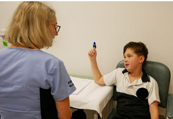 Lincoln chats with Senior Occupational Therapist Barb Hall at the new South West Virtual Hand Surgery Clinic.