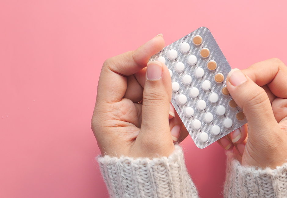 Hands holding packet of contraceptive pills