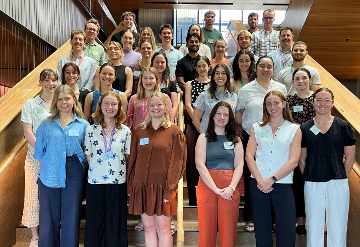 Group of people standing on staircase.