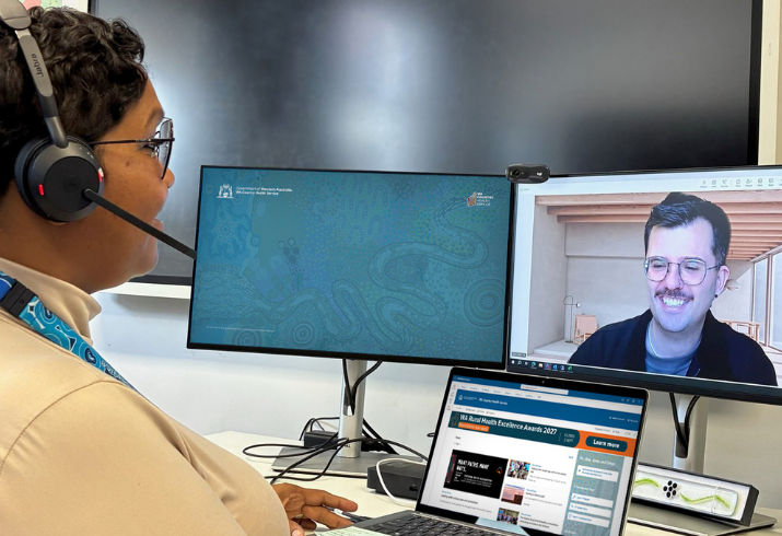 Staff member talking with a patient via video call.