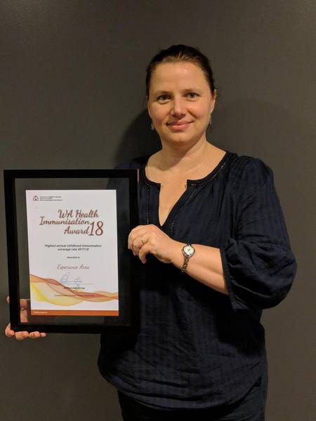 Regional Immunisation Coordinator Rebecca Caporn accepts the award for highest annual childhood immunisation rates.