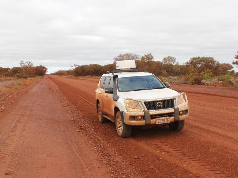 Car on road dirt outback road