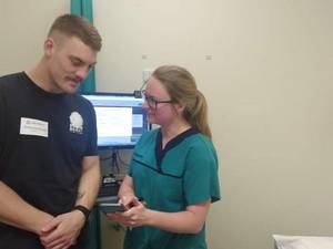 Patient Tom Coleman with physio Madison Davis.
